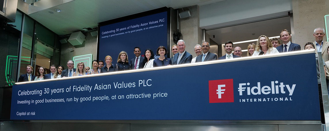 The team celebrating on the balcony at LSEG during the welcome ceremony.