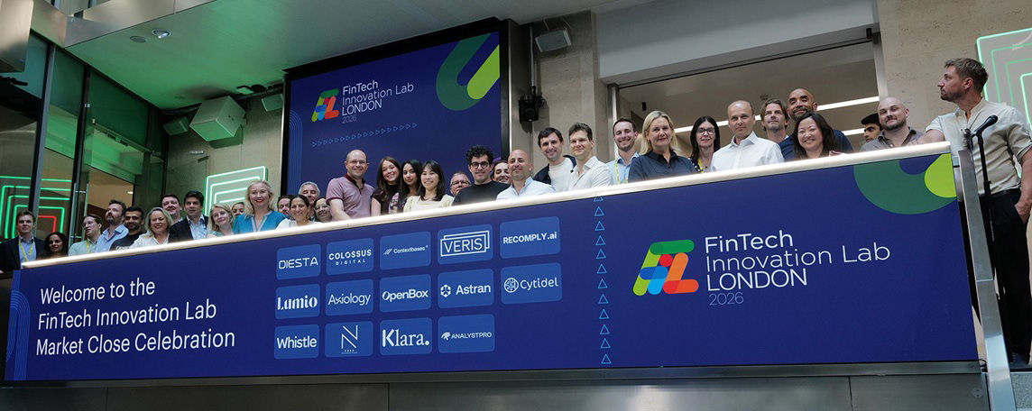 The team celebrating on the balcony at LSEG during the welcome ceremony.