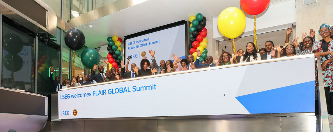 The team celebrating on the balcony at LSEG during the welcome ceremony.