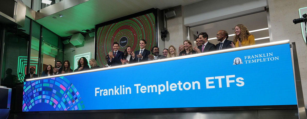 The team celebrating on the balcony at LSEG during the welcome ceremony.
