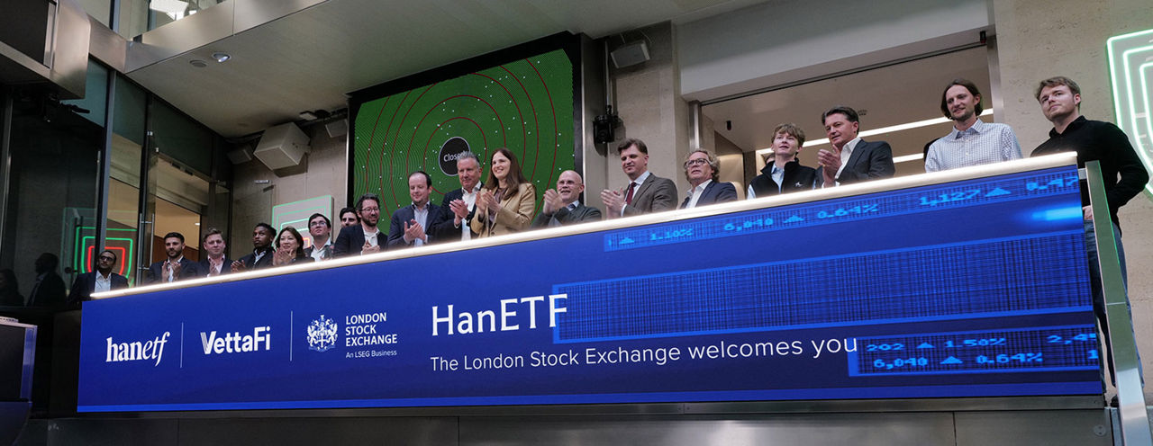 The team celebrating on the balcony at LSEG during the welcome ceremony.