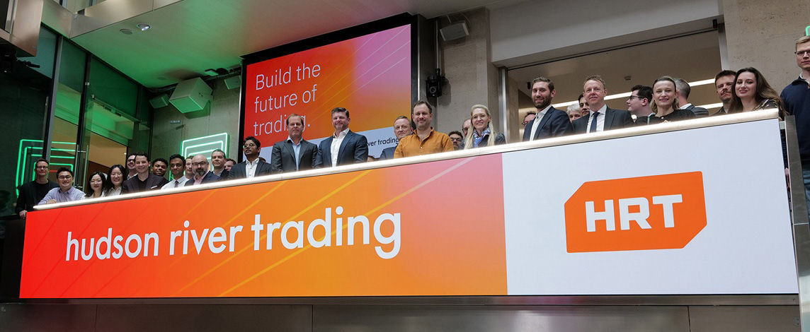 The team celebrating on the balcony at LSEG during the welcome ceremony.