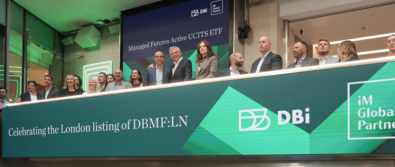 The team celebrating on the balcony at LSEG during the welcome ceremony.