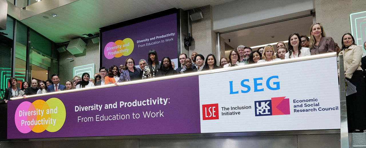 The team celebrating on the balcony at LSEG during the welcome ceremony.
