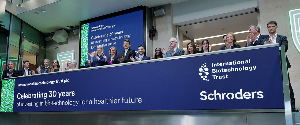 The team celebrating on the balcony at LSEG during the welcome ceremony.