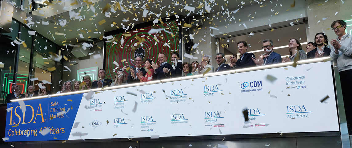 The team celebrating on the balcony at LSEG during the welcome ceremony.