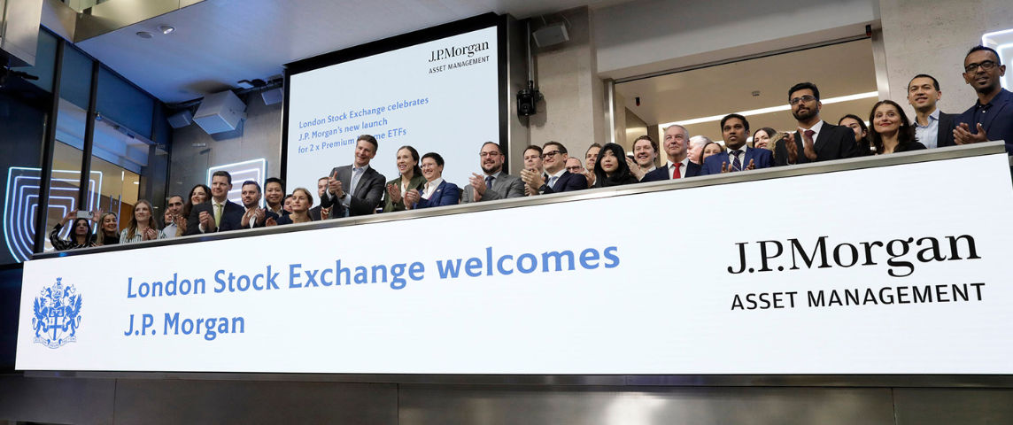 The team celebrating on the balcony at LSEG during the welcome ceremony.