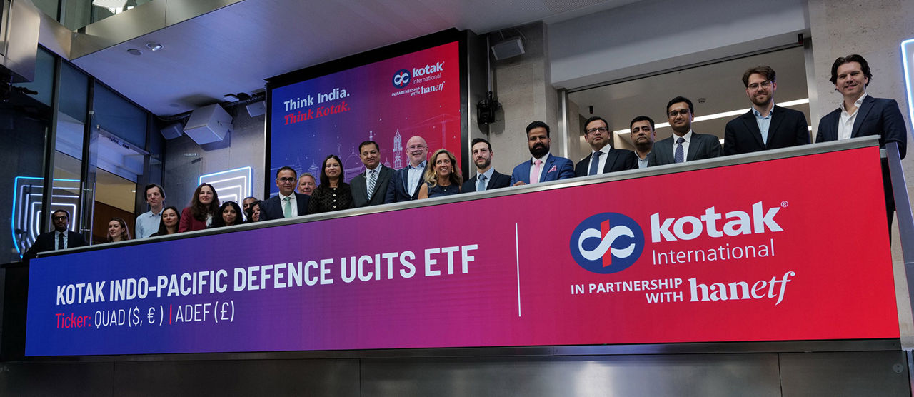 The team celebrating on the balcony at LSEG during the welcome ceremony.
