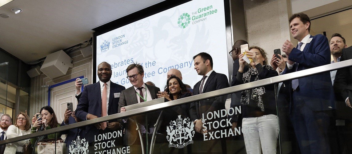 The team celebrating on the balcony at LSEG during the welcome ceremony.