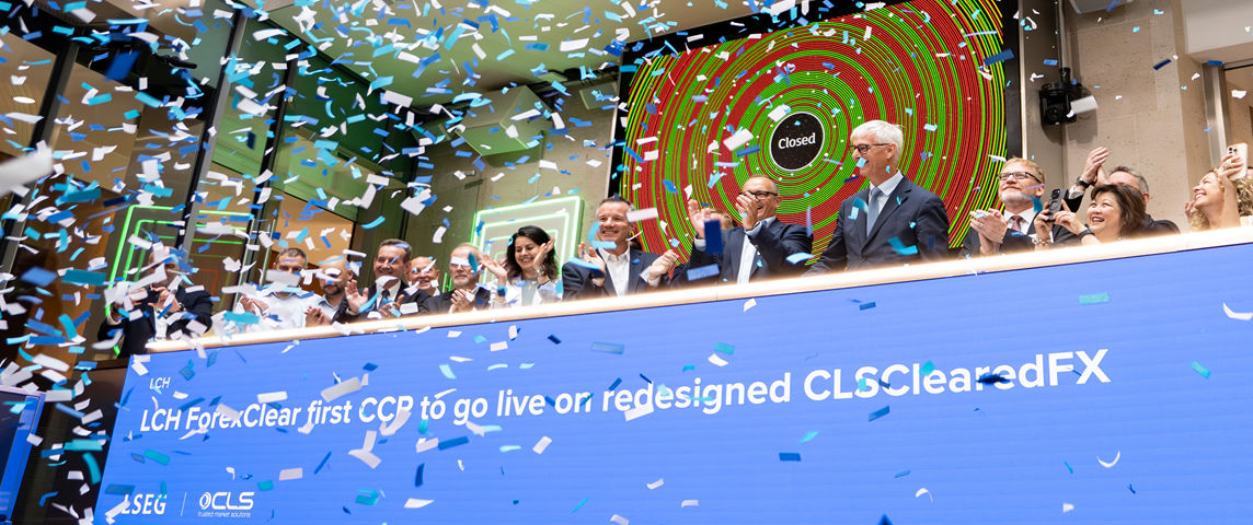 The team celebrating on the balcony at LSEG during the welcome ceremony.
