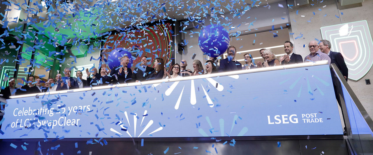 The team celebrating on the balcony at LSEG during the welcome ceremony.