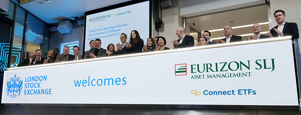 The team celebrating on the balcony at LSEG during the welcome ceremony.