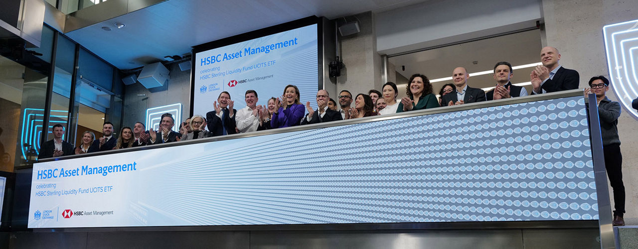 The team celebrating on the balcony at LSEG during the welcome ceremony.