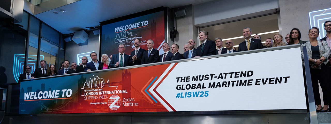 The team celebrating on the balcony at LSEG during the welcome ceremony.