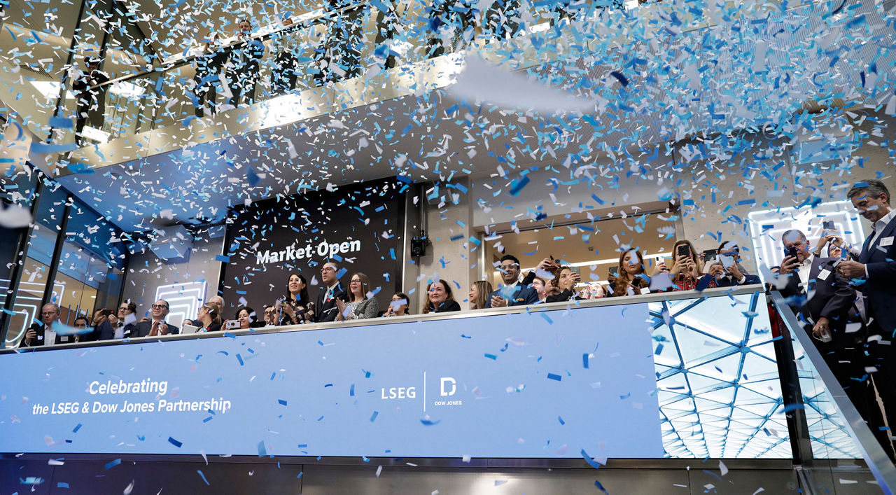 The team celebrating on the balcony at LSEG during the welcome ceremony.