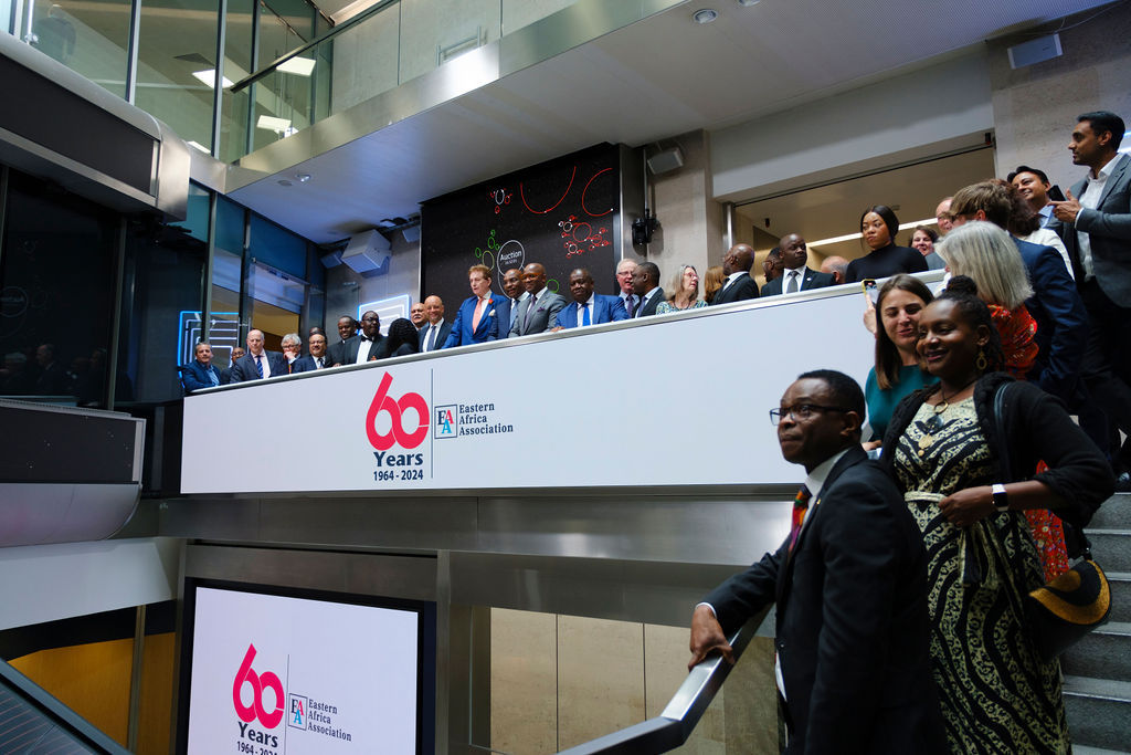 The team celebrating on the balcony at LSEG during the welcome ceremony.