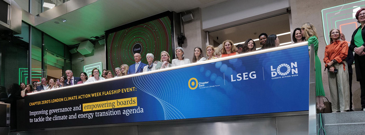 The team celebrating on the balcony at LSEG during the welcome ceremony.