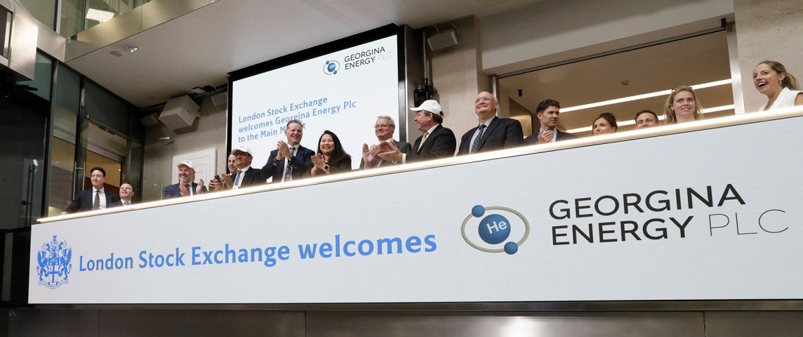 The team celebrating on the balcony at LSEG during the welcome ceremony.
