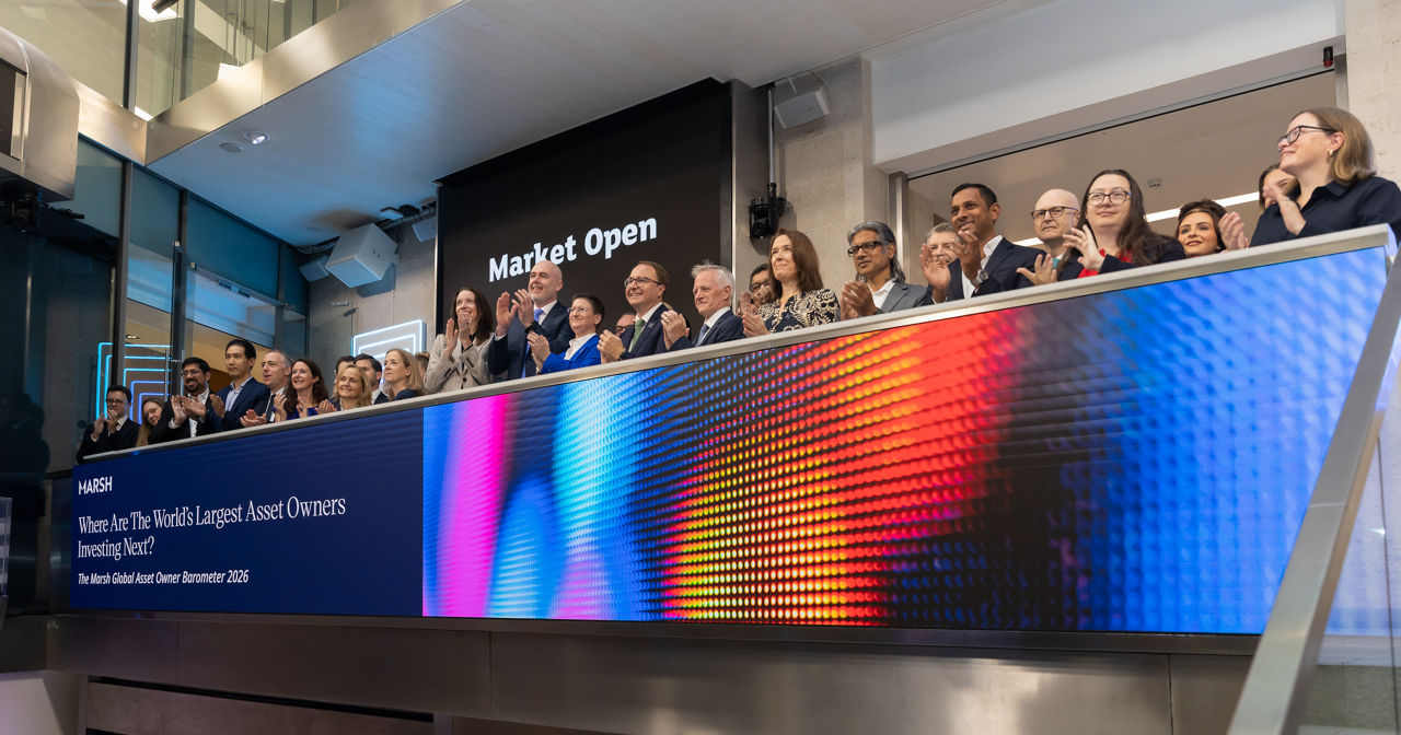 The team celebrating on the balcony at LSEG during the welcome ceremony.