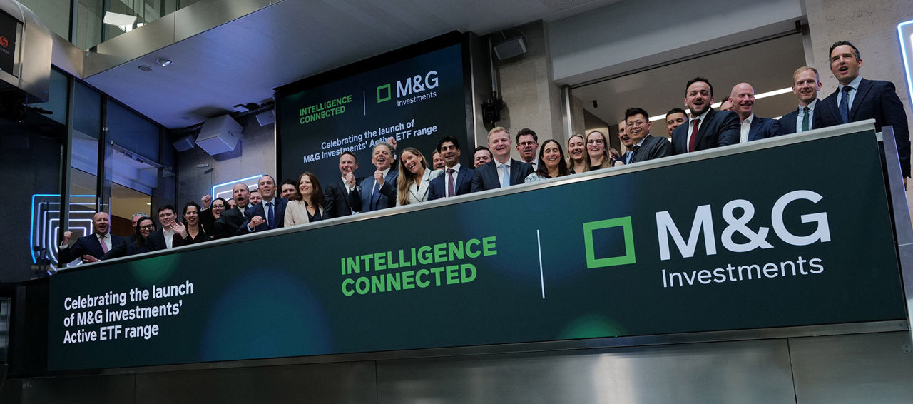 The team celebrating on the balcony at LSEG during the welcome ceremony.