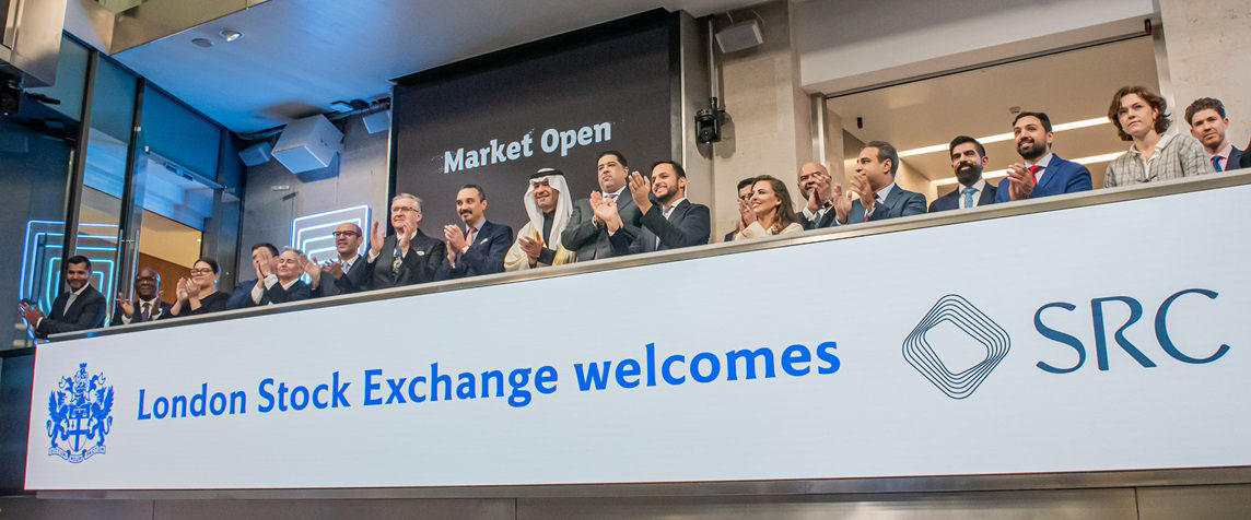 The team celebrating on the balcony at LSEG during the welcome ceremony.