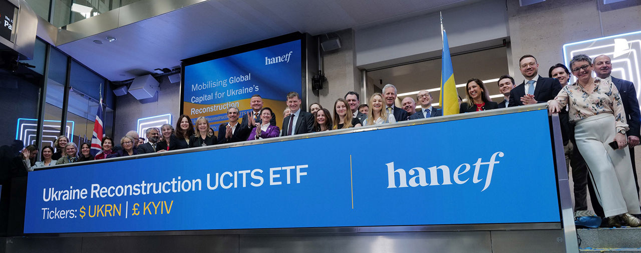 The team celebrating on the balcony at LSEG during the welcome ceremony.