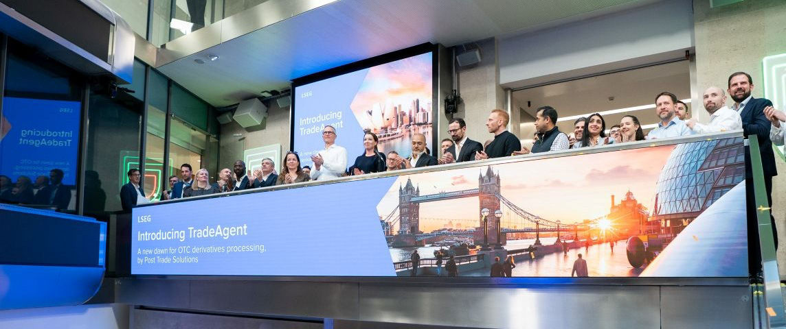 The team celebrating on the balcony at LSEG during the welcome ceremony.