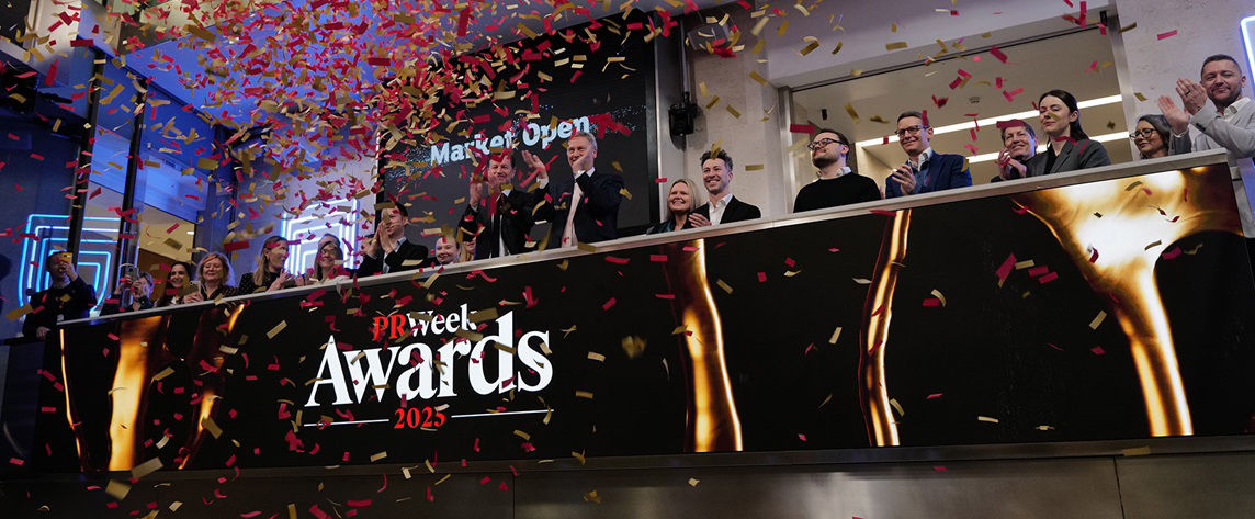 The team celebrating on the balcony at LSEG during the welcome ceremony.
