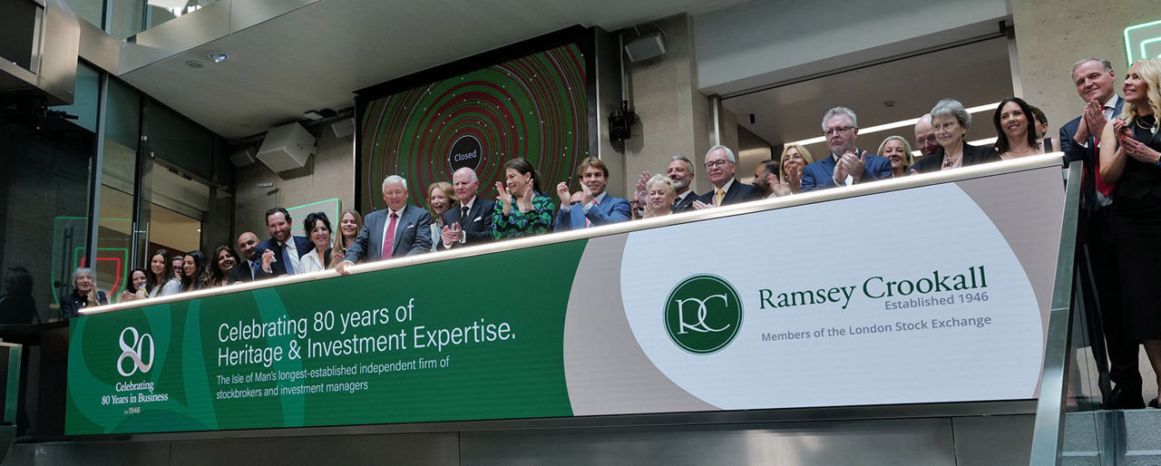The team celebrating on the balcony at LSEG during the welcome ceremony.