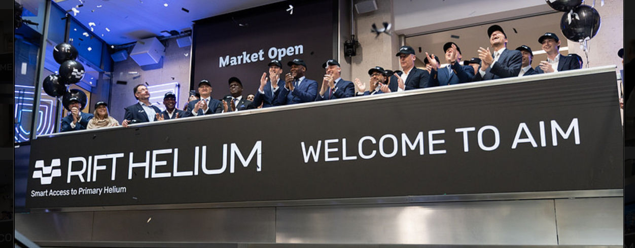 The team celebrating on the balcony at LSEG during the welcome ceremony.