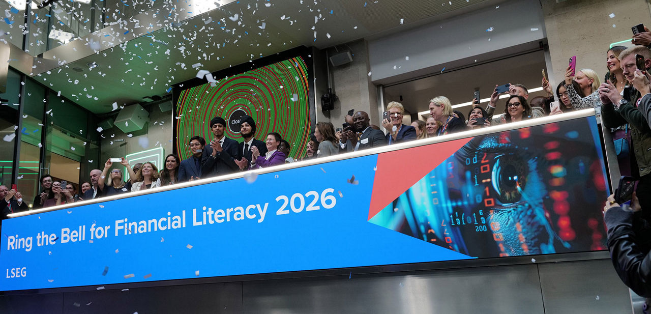 The team celebrating on the balcony at LSEG during the welcome ceremony.