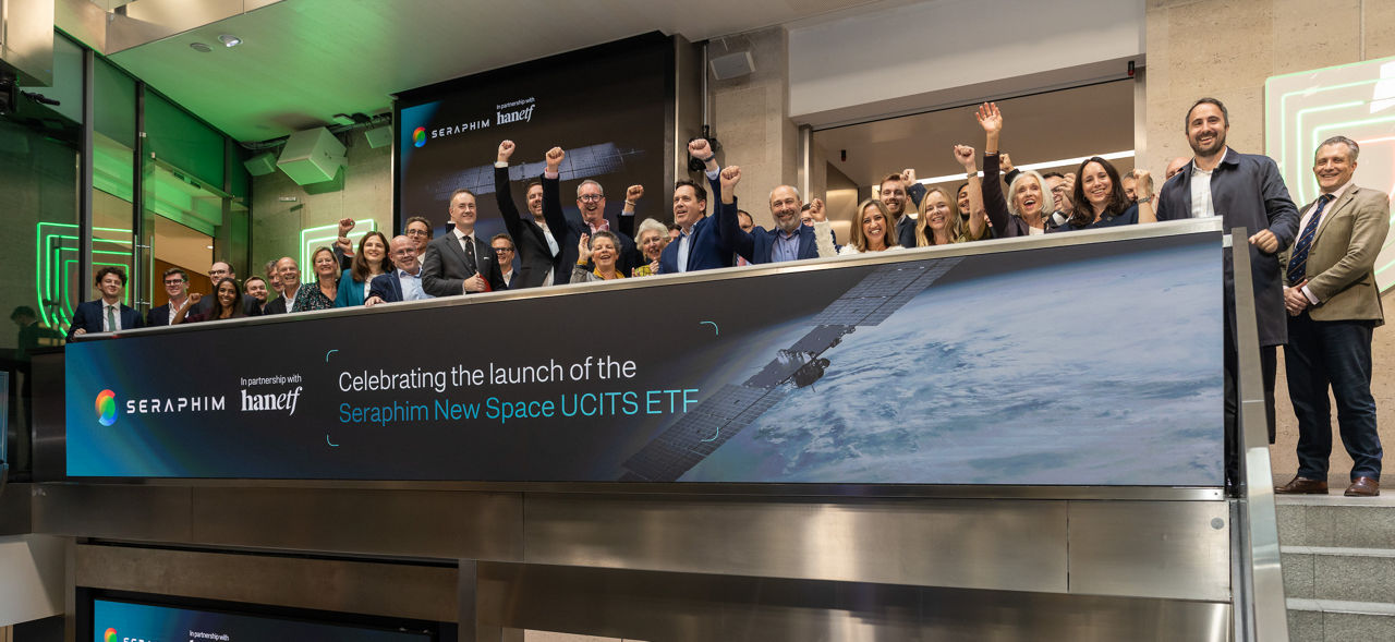 The team celebrating on the balcony at LSEG during the welcome ceremony.