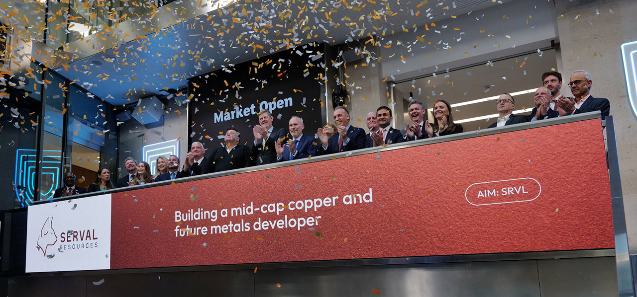 The team celebrating on the balcony at LSEG during the welcome ceremony.