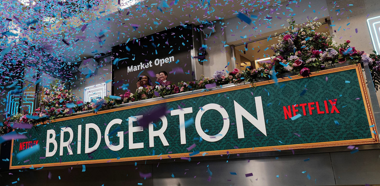 The team celebrating on the balcony at LSEG during the welcome ceremony.