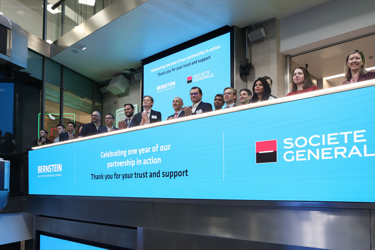 The team celebrating on the balcony at LSEG during the welcome ceremony.