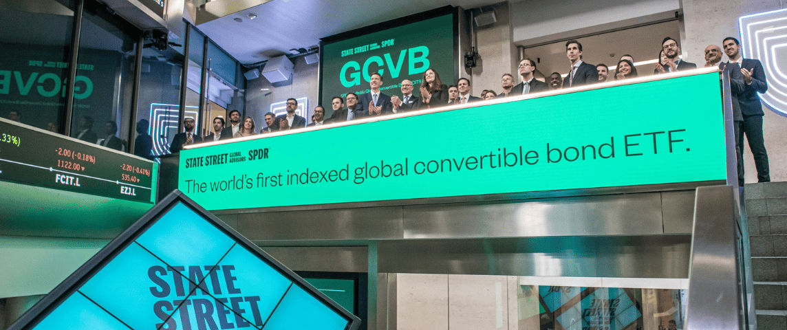 The team celebrating on the balcony at LSEG during the welcome ceremony.