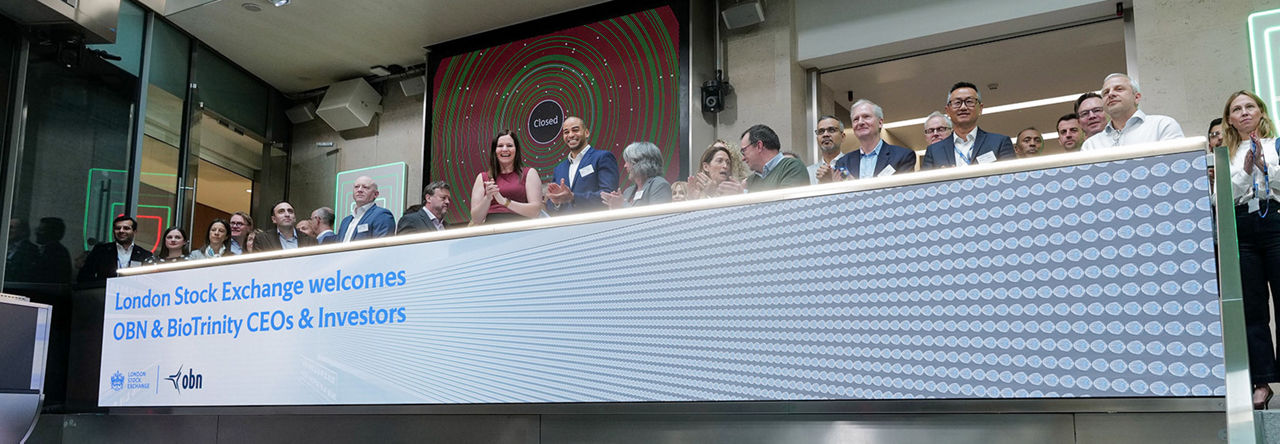 The team celebrating on the balcony at LSEG during the welcome ceremony.