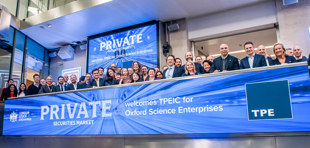 The team celebrating on the balcony at LSEG during the welcome ceremony.