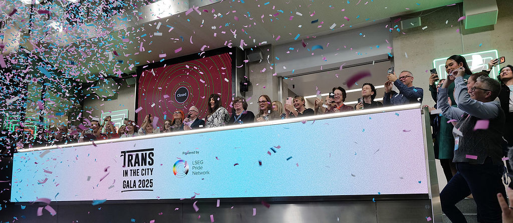 The team celebrating on the balcony at LSEG during the welcome ceremony.