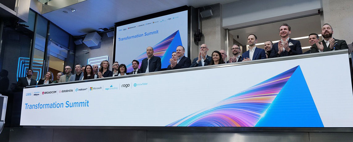 The team celebrating on the balcony at LSEG during the welcome ceremony.