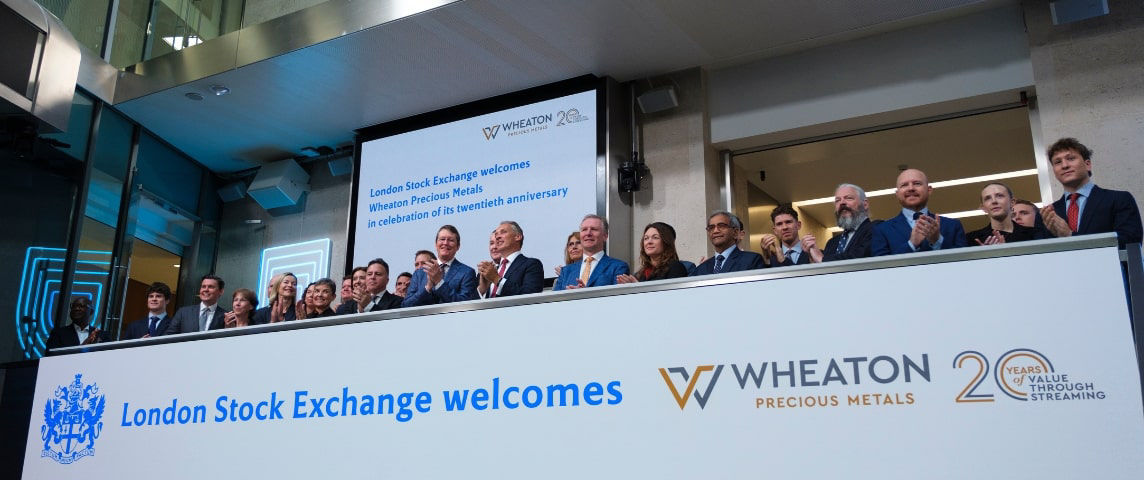 The team celebrating on the balcony at LSEG during the welcome ceremony.