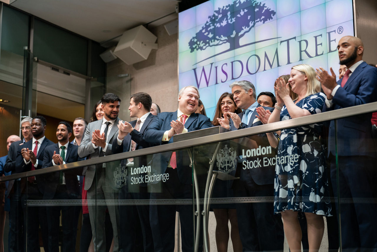 The team celebrating on the balcony at LSEG during the welcome ceremony.