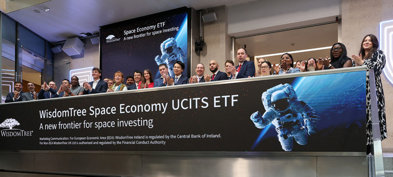 The team celebrating on the balcony at LSEG during the welcome ceremony.